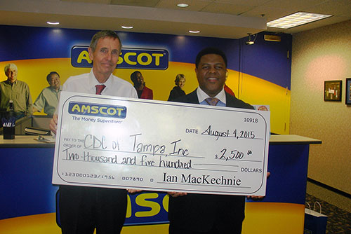 Ian MacKechnie presents check to CDC