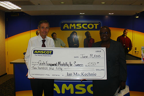 Ian MacKechnie presents donation to Girls Empowered